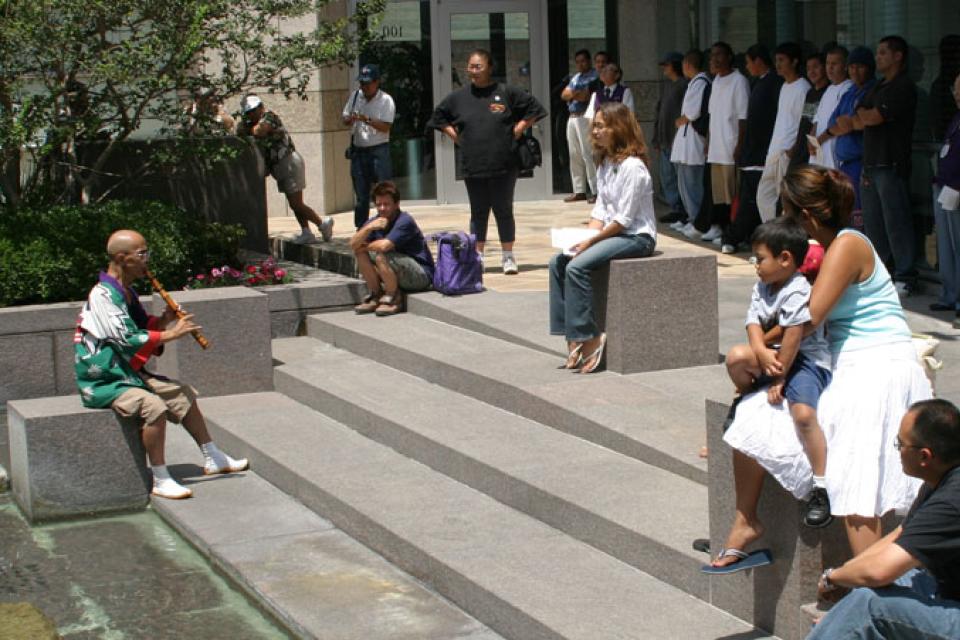 George Abe plays in the Manabi and Sumi Hirasaki Family Garden outdoors
